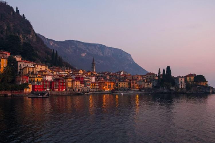 The sun setting over Lake Como is something you’ll never forget. Credit: Julia Solonina / Unsplash